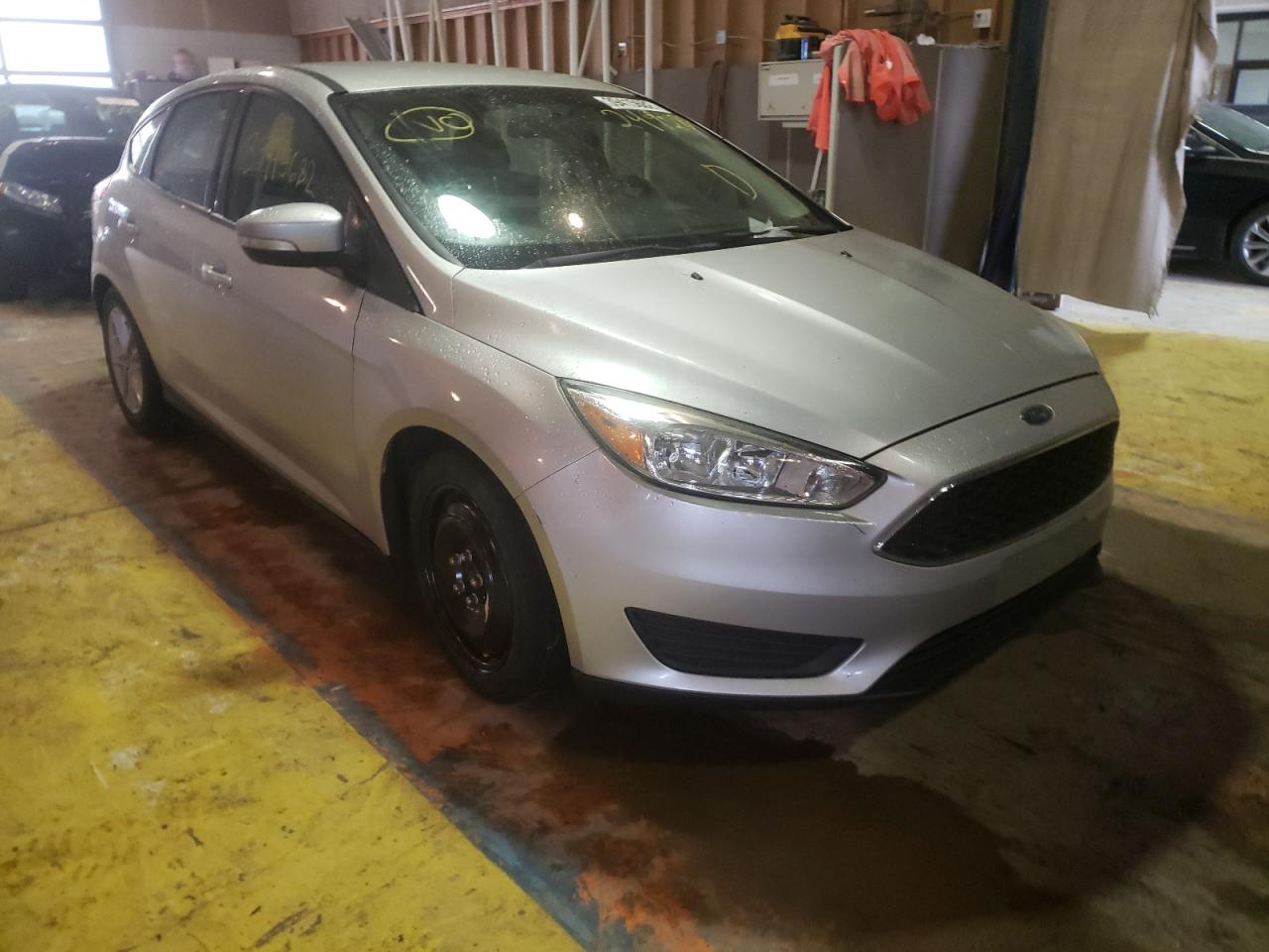 FORD FOCUS SE 2015 with VIN 1FADP3K28FL249284 - Photo from auction