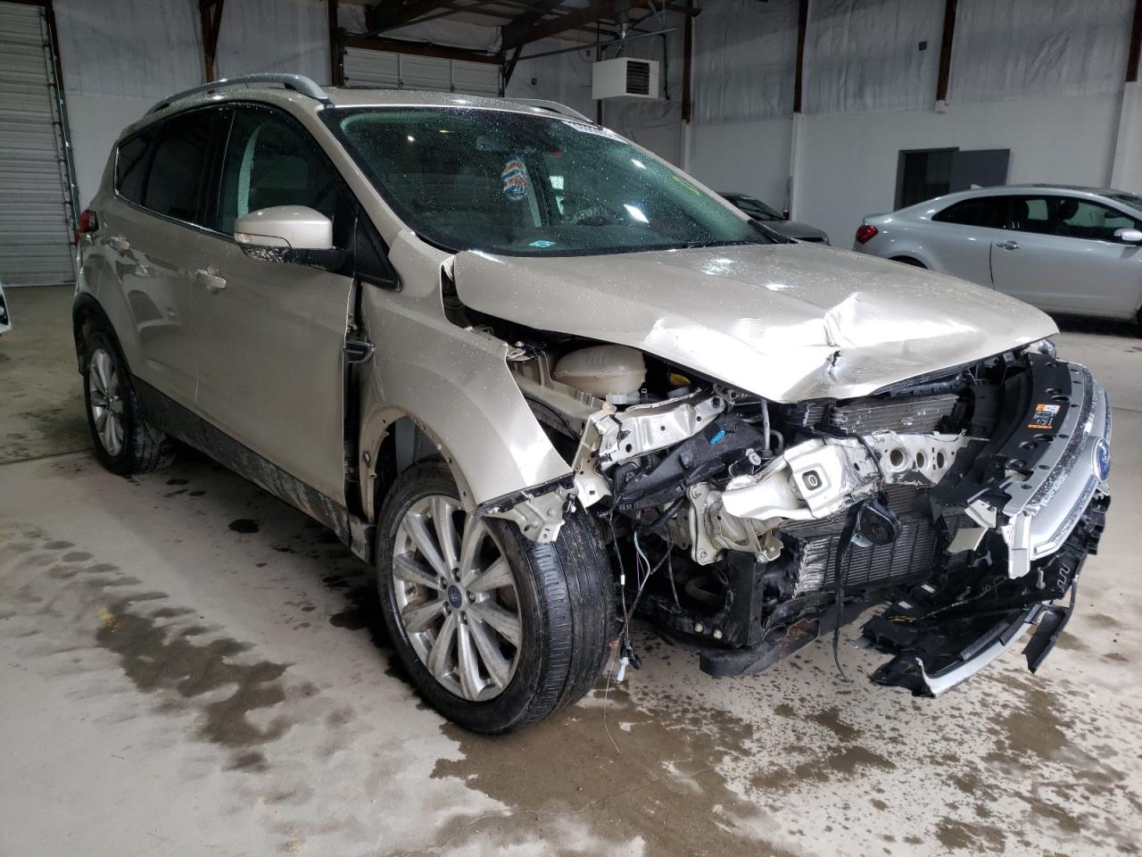 FORD ESCAPE TIT 2017 with VIN 1FMCU0JD3HUC86042 - Photo from auction
