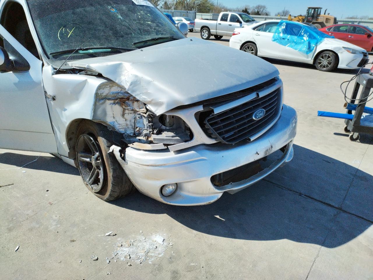 Photo 9 from auction – 2004 FORD F150 SVT L with VIN 2FTRF07354CA66239
