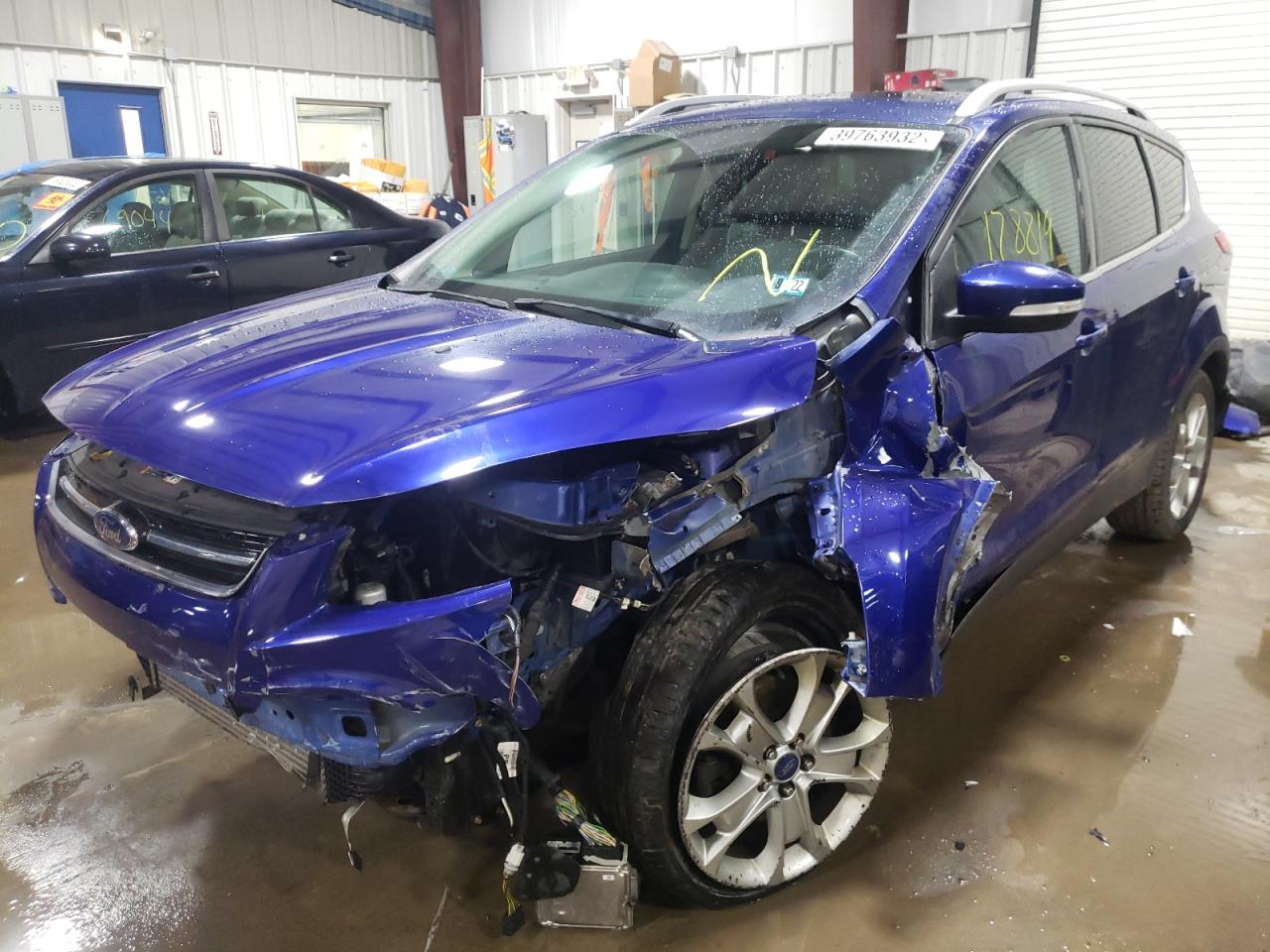 Photo 2 from auction – 2015 FORD ESCAPE TIT with VIN 1FMCU9J92FUC76180