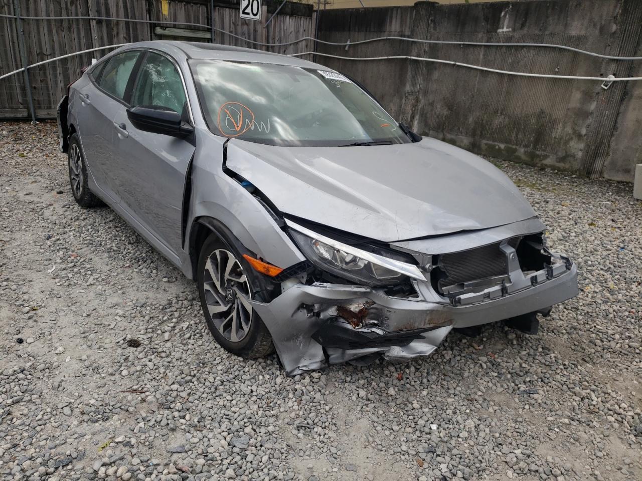 HONDA CIVIC EX 2018 with VIN 19XFC2F72JE024942 - Photo from auction