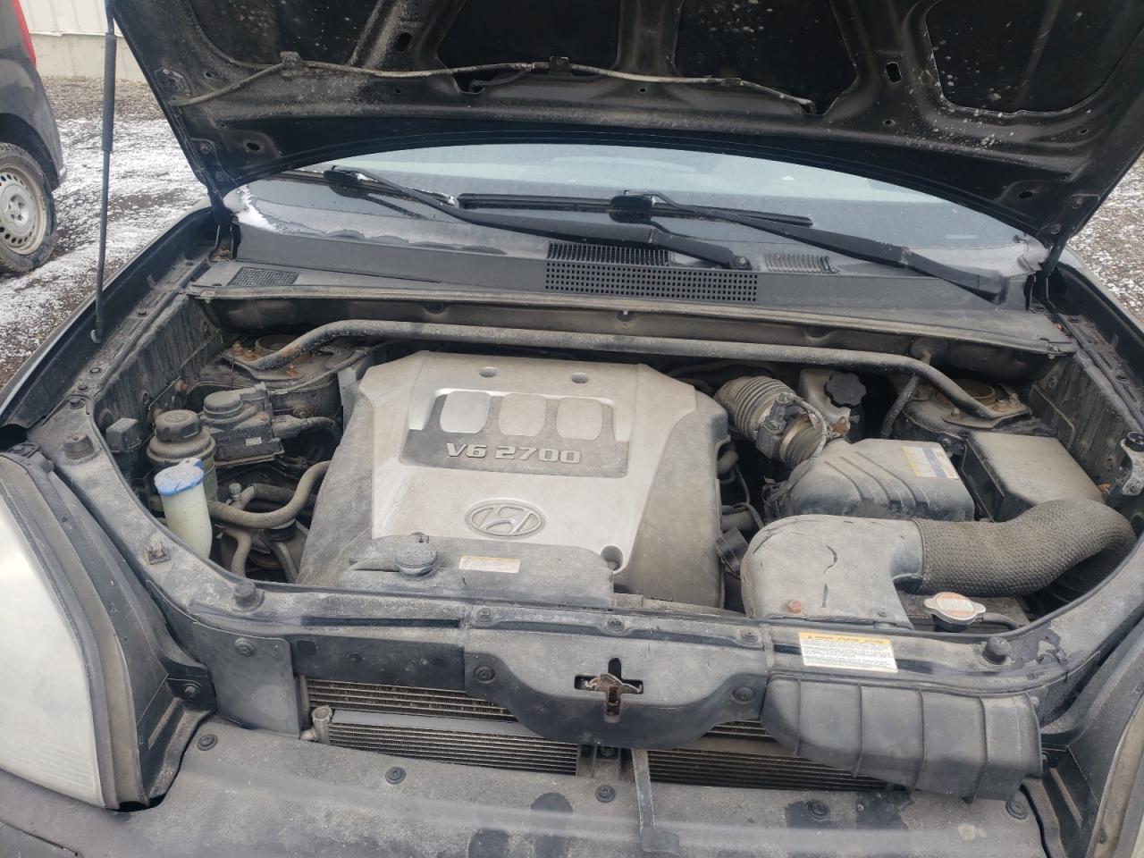 Photo 7 from auction – 2006 HYUNDAI TUCSON GL with VIN KM8JM72D06U340604