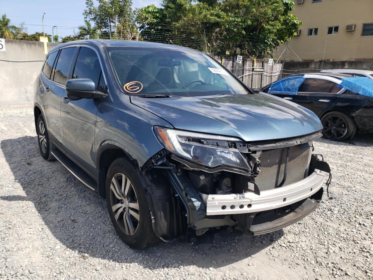 HONDA PILOT EXL 2018 with VIN 5FNYF5H5XJB012027 - Photo from auction