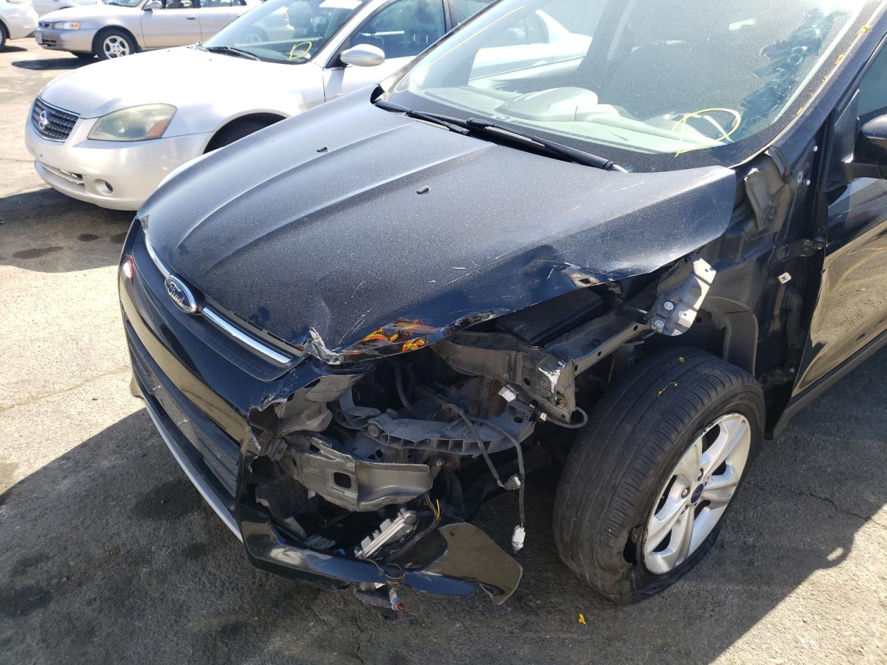 Photo 9 from auction – 2016 FORD ESCAPE SE with VIN 1FMCU0GX6GUA53501
