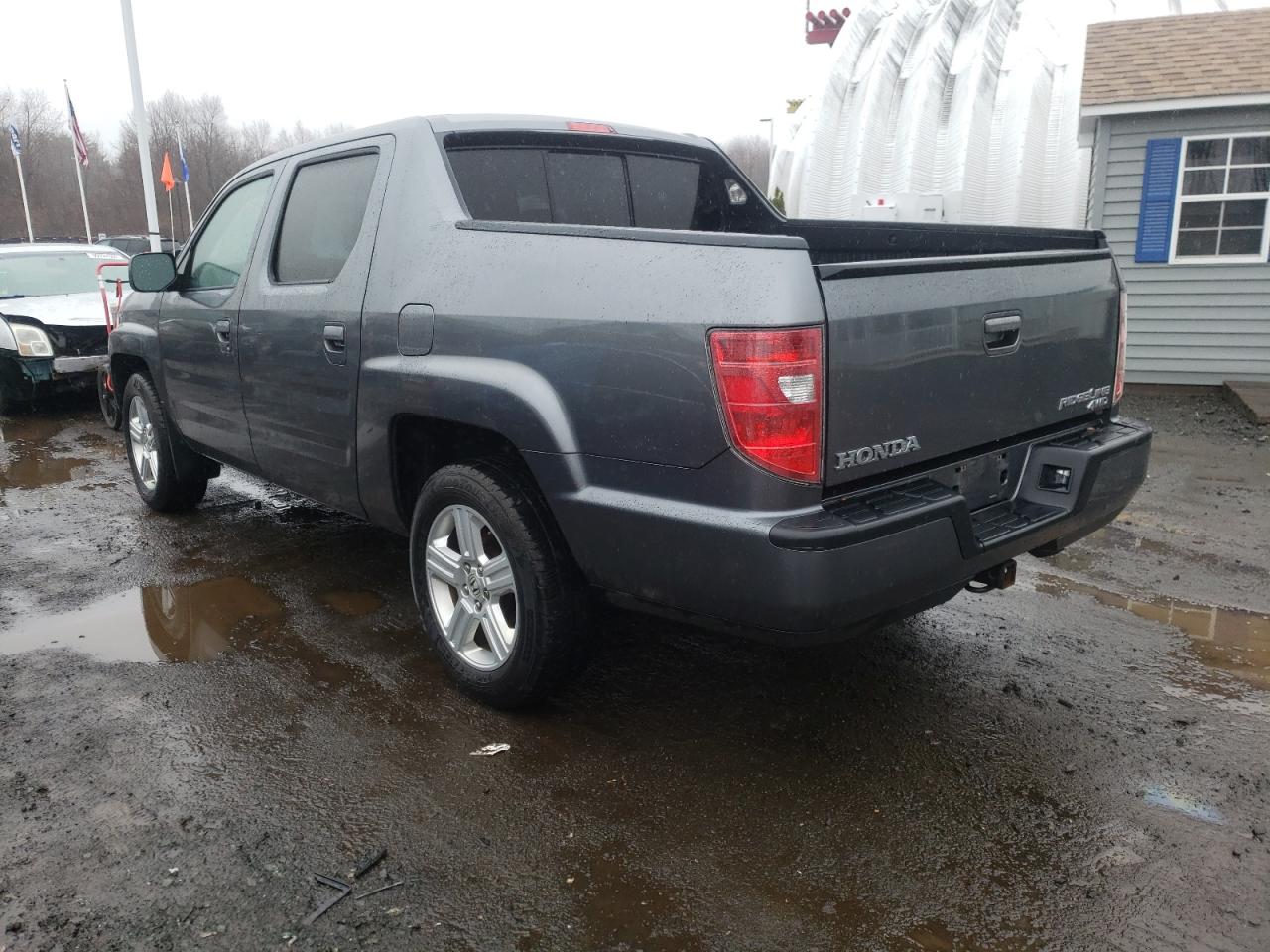 Photo 3 from auction – 2011 HONDA RIDGELINE with VIN 5FPYK1F50BB454993