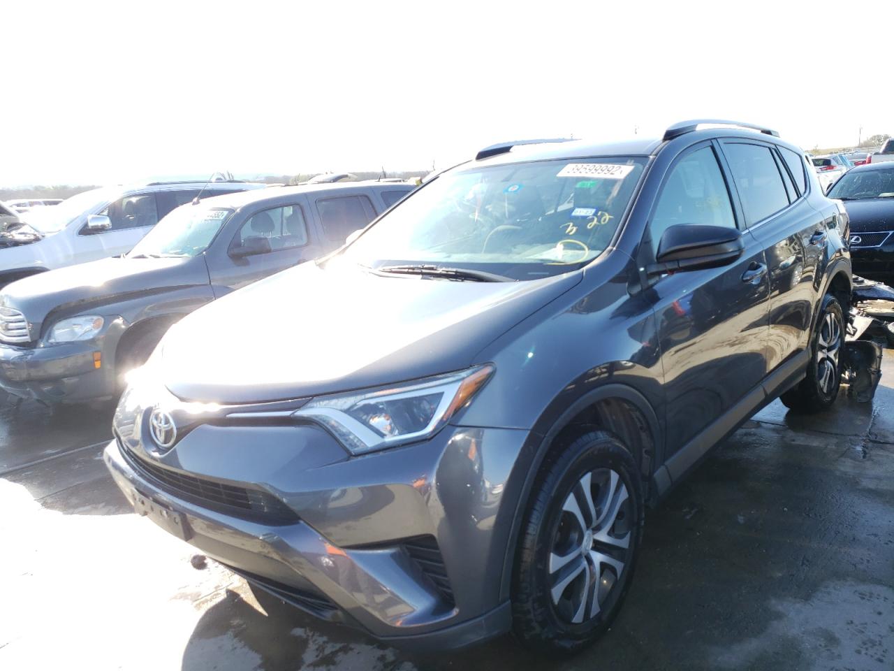 Photo 2 from auction – 2016 TOYOTA RAV4 LE with VIN JTMZFREV2GJ070571