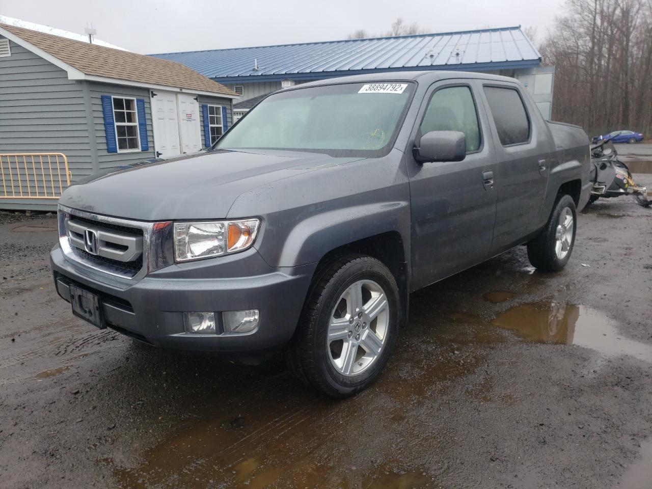 Photo 2 from auction – 2011 HONDA RIDGELINE with VIN 5FPYK1F50BB454993