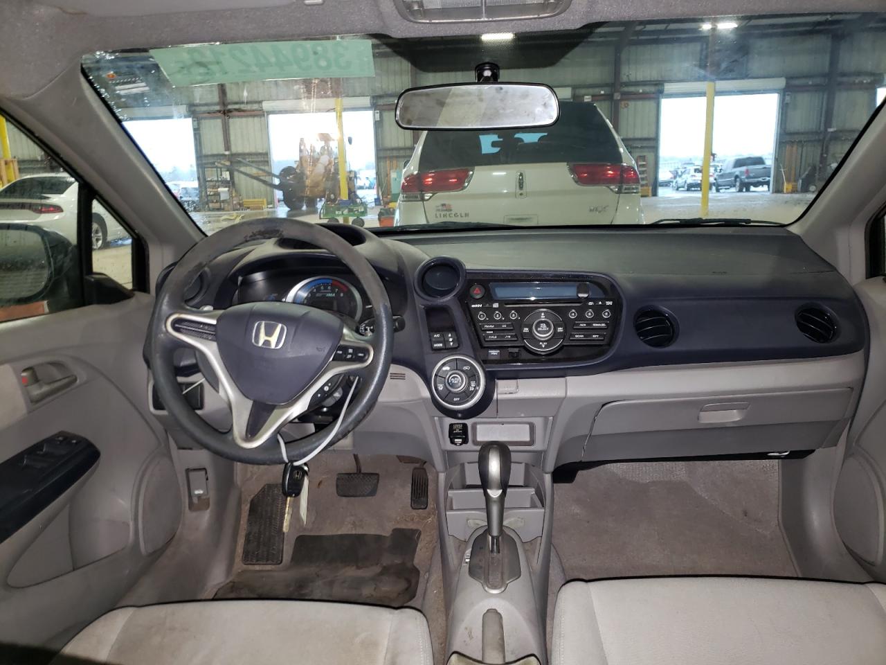 Photo 9 from auction – 2010 HONDA INSIGHT EX with VIN JHMZE2H7XAS015745