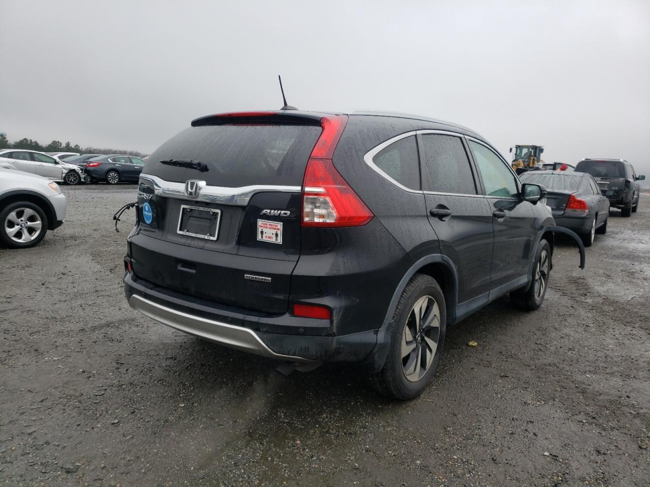 Photo 4 from auction – 2016 HONDA CR-V TOURI with VIN 5J6RM4H99GL057337