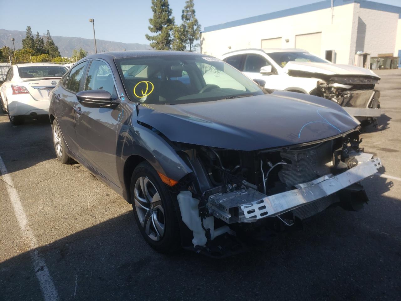 HONDA CIVIC LX 2018 with VIN 2HGFC2F57JH571743 - Photo from auction