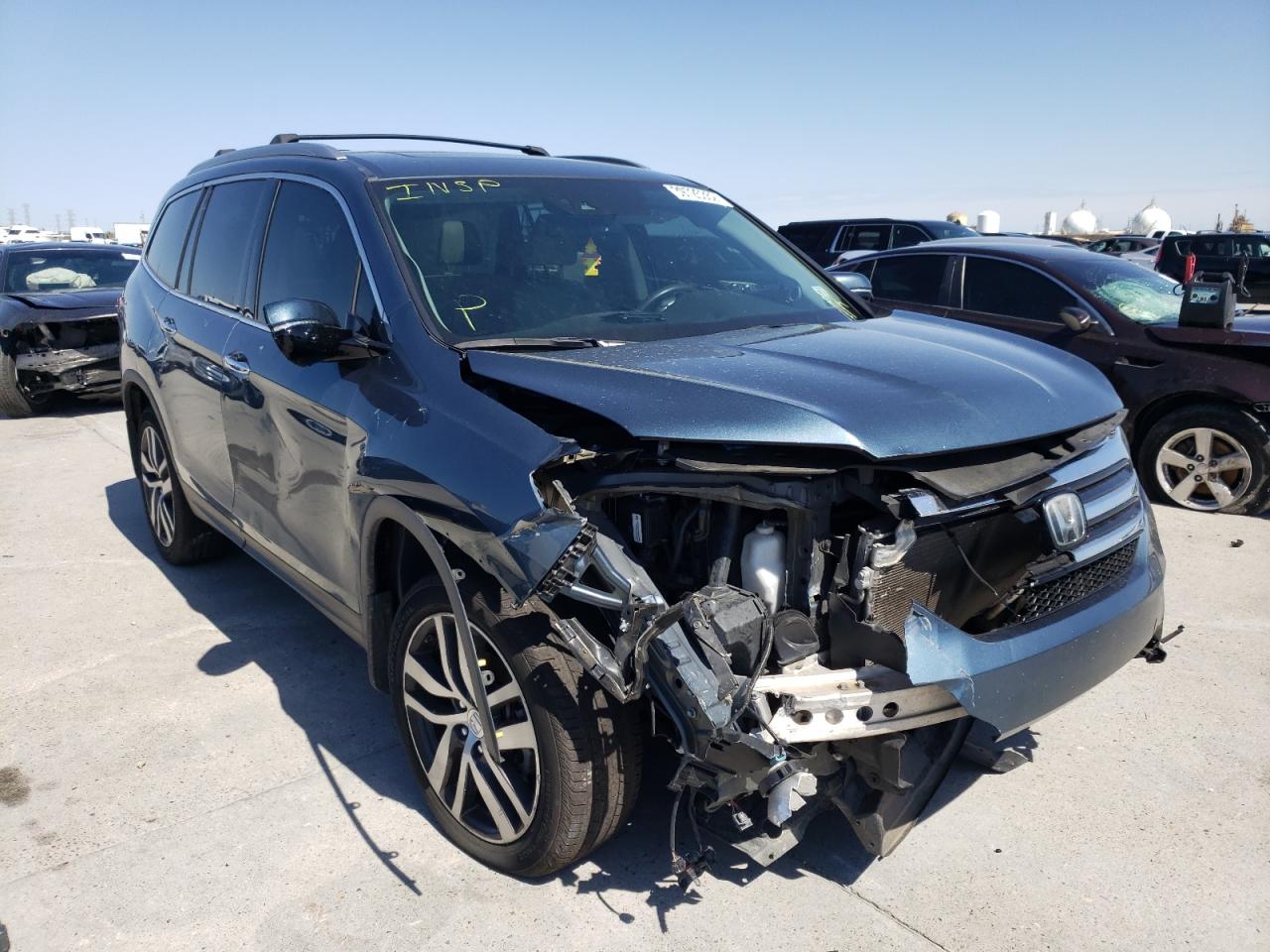 HONDA PILOT ELIT 2017 with VIN 5FNYF6H02HB062070 - Photo from auction