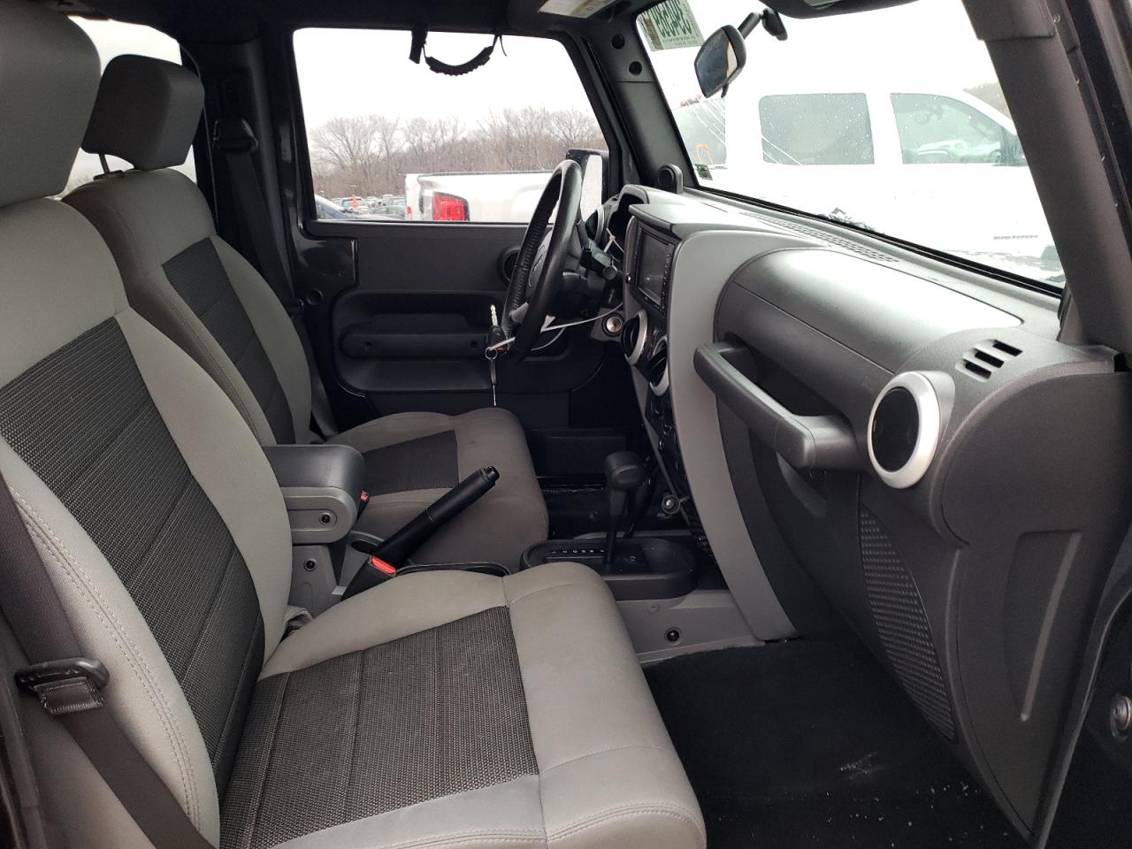 Photo 5 from auction – 2010 JEEP WRANGLER U with VIN 1J4BA5H15AL124730