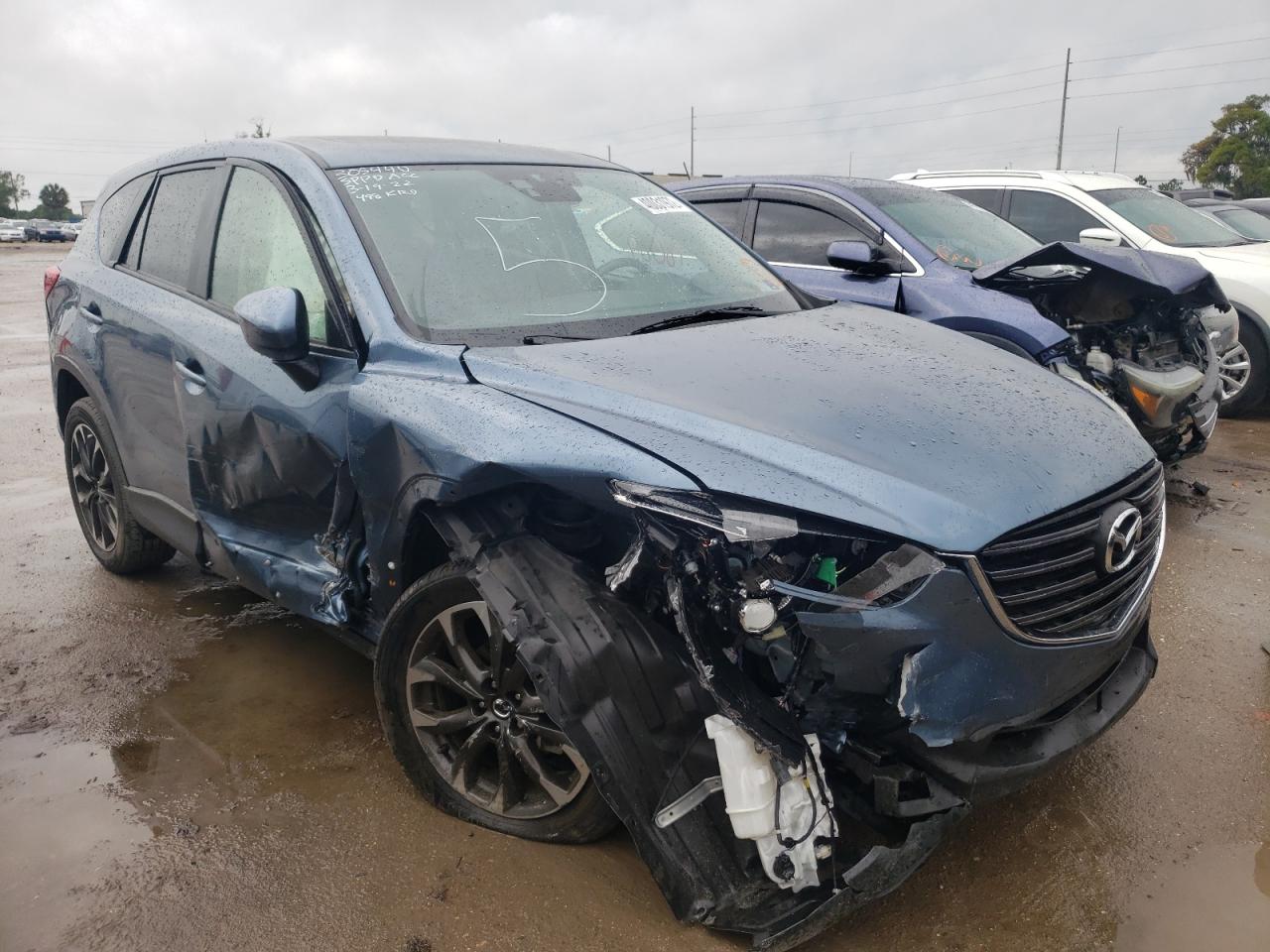 MAZDA CX-5 GT 2016 with VIN JM3KE2DYXG0667990 - Photo from auction