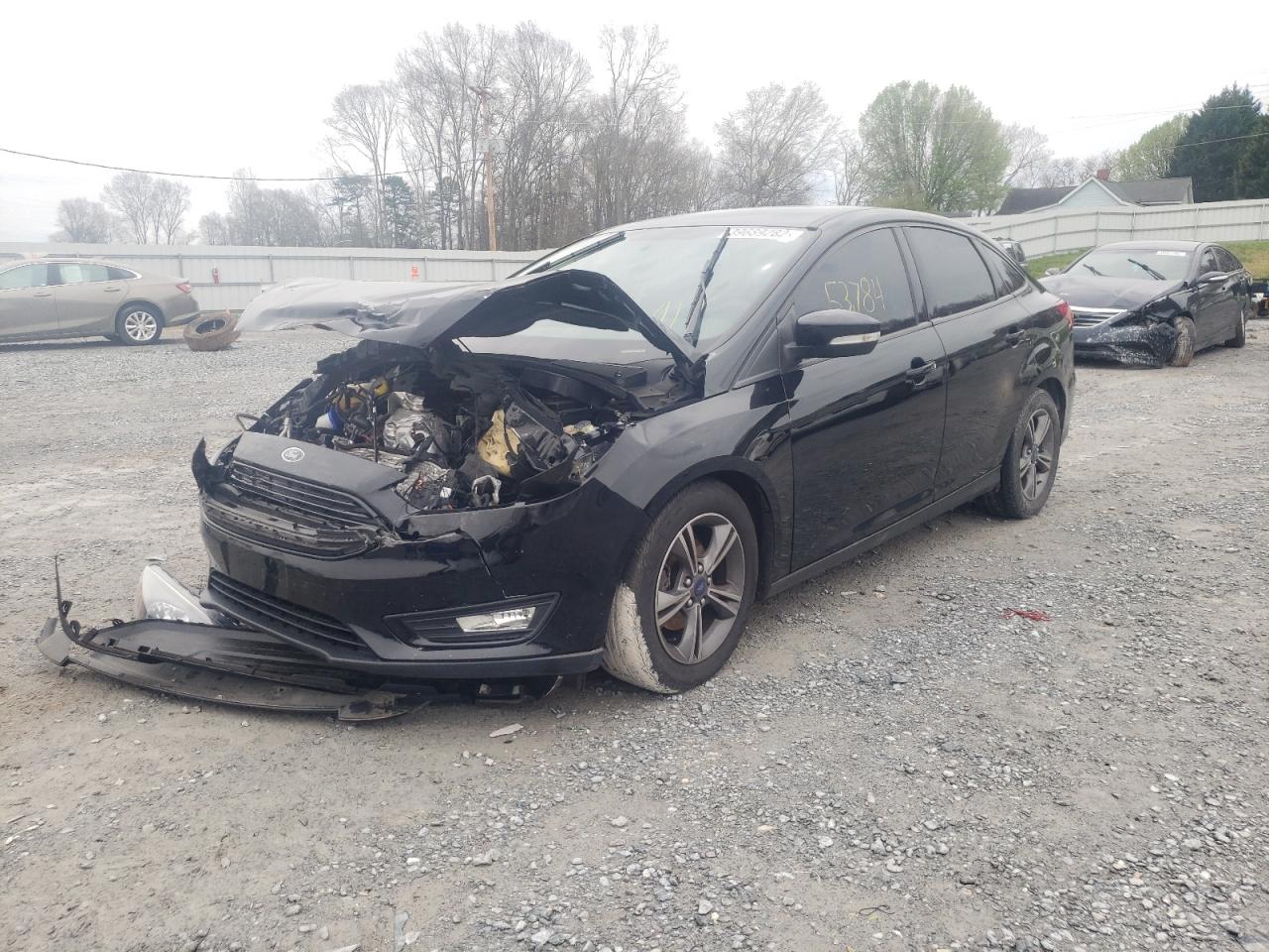 Photo 2 from auction – 2017 FORD FOCUS SE with VIN 1FADP3FE5HL335370