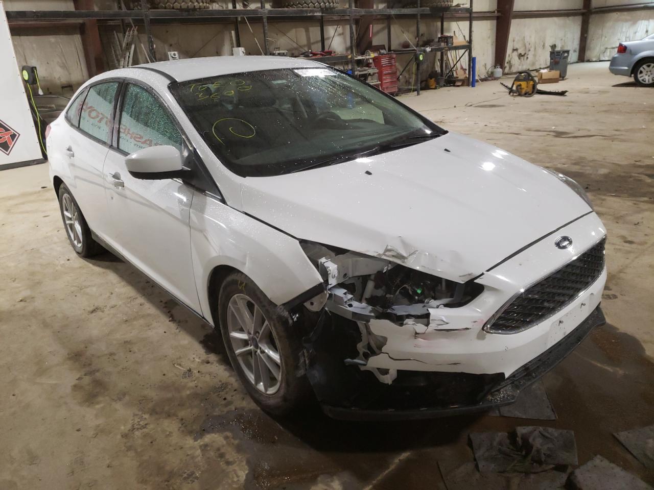 FORD FOCUS SE 2018 with VIN 1FADP3F27JL261249 - Photo from auction
