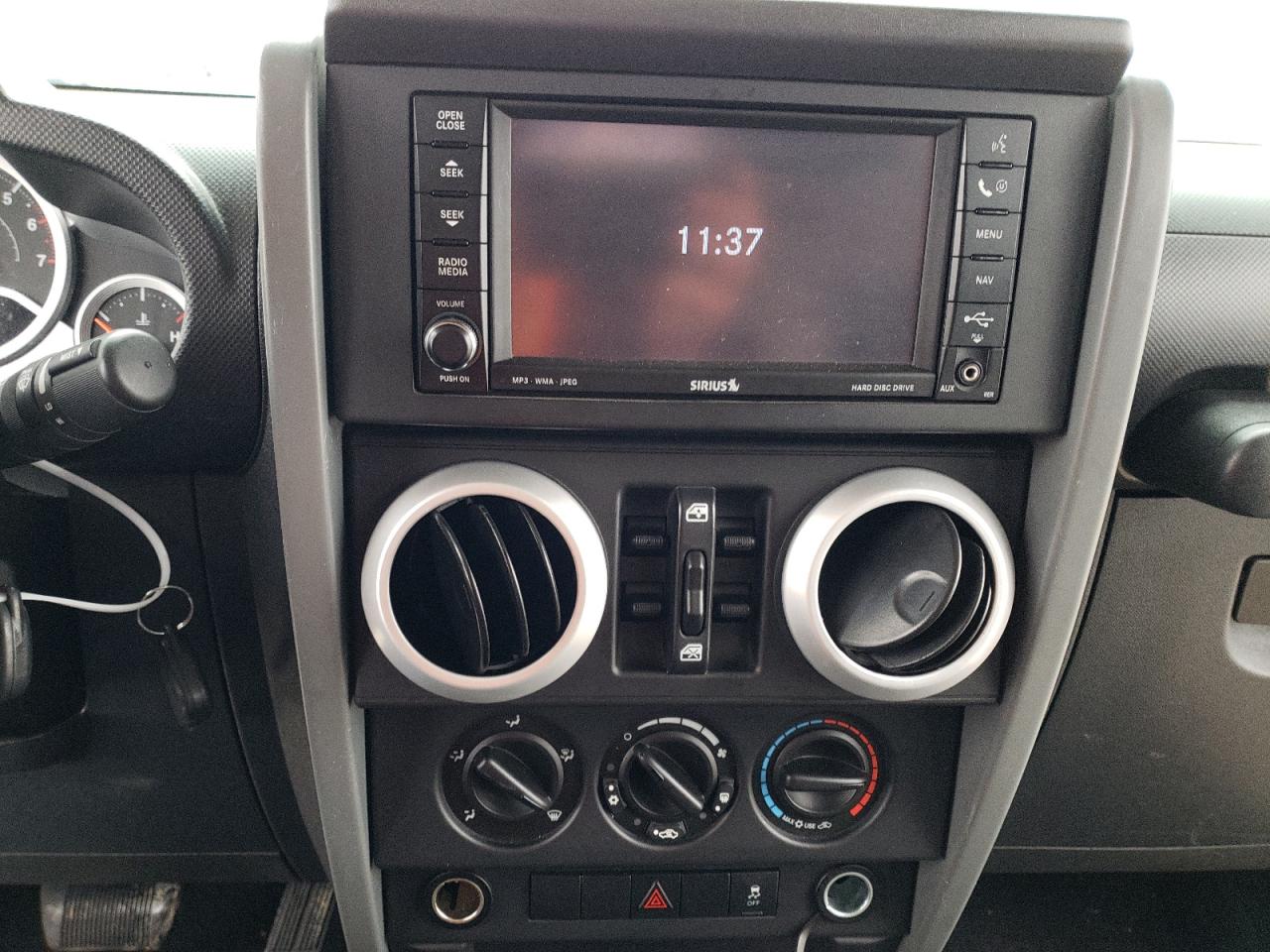 Photo 9 from auction – 2010 JEEP WRANGLER U with VIN 1J4BA5H15AL124730