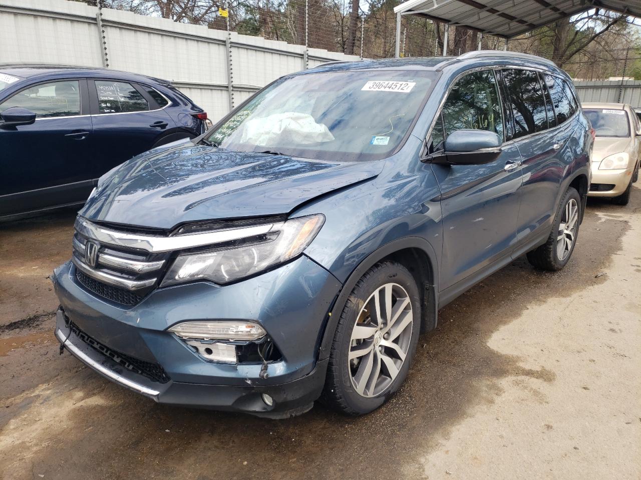 Photo 2 from auction – 2016 HONDA PILOT TOUR with VIN 5FNYF5H98GB010062