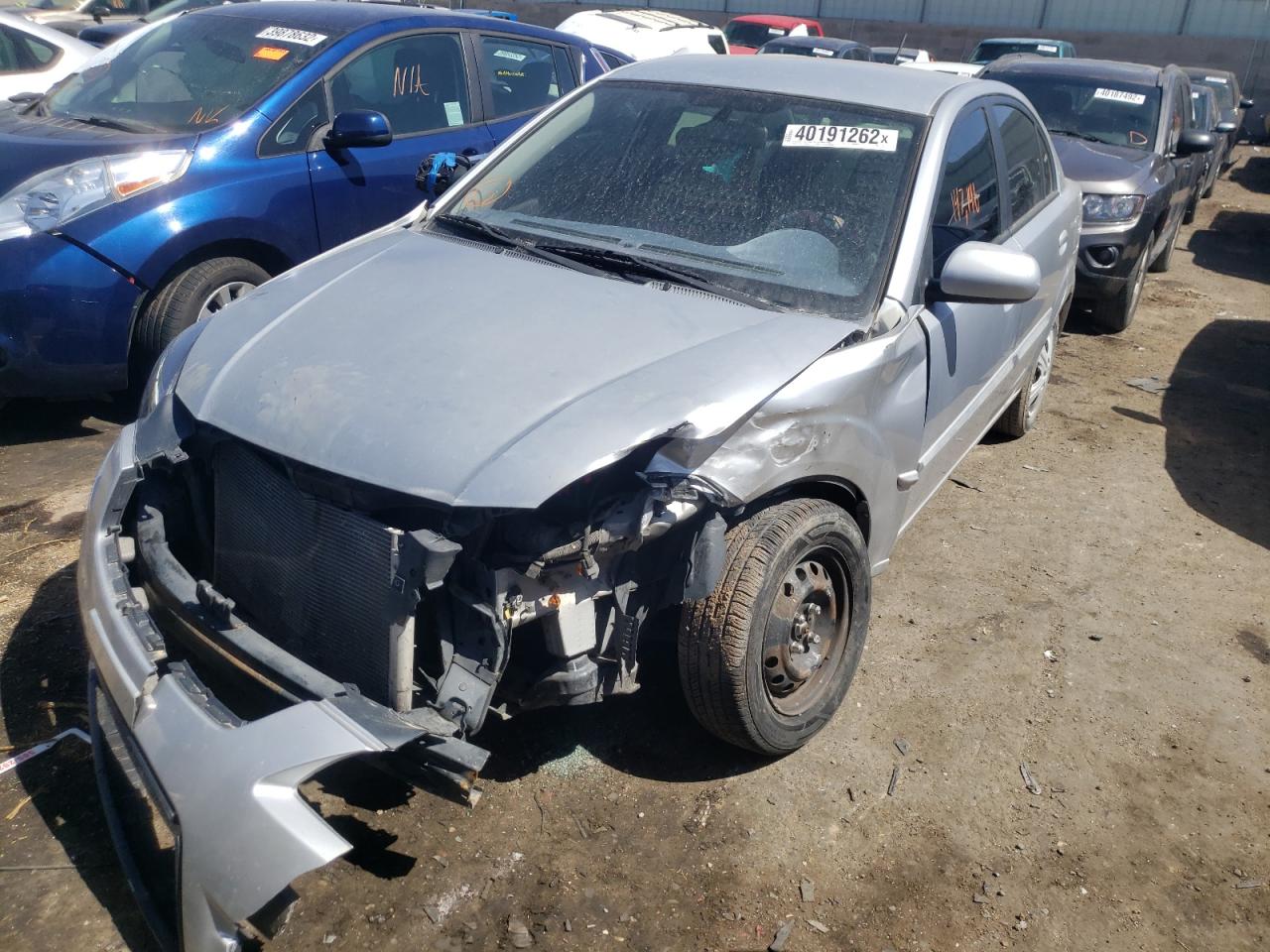 Photo 2 from auction – 2011 KIA RIO BASE with VIN KNADH4A34B6916395