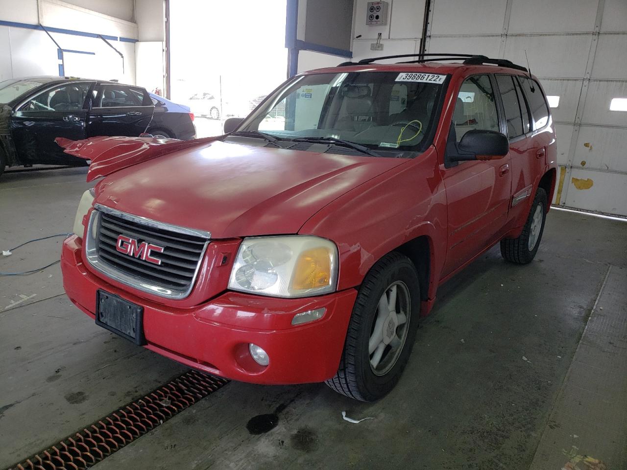 Photo 2 from auction – 2002 GMC ENVOY with VIN 1GKDT13S222123323
