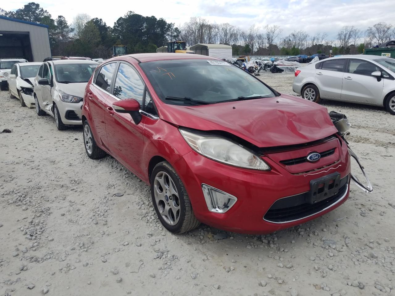 FORD FIESTA SES 2011 with VIN 3FADP4FJ4BM223197 - Photo from auction