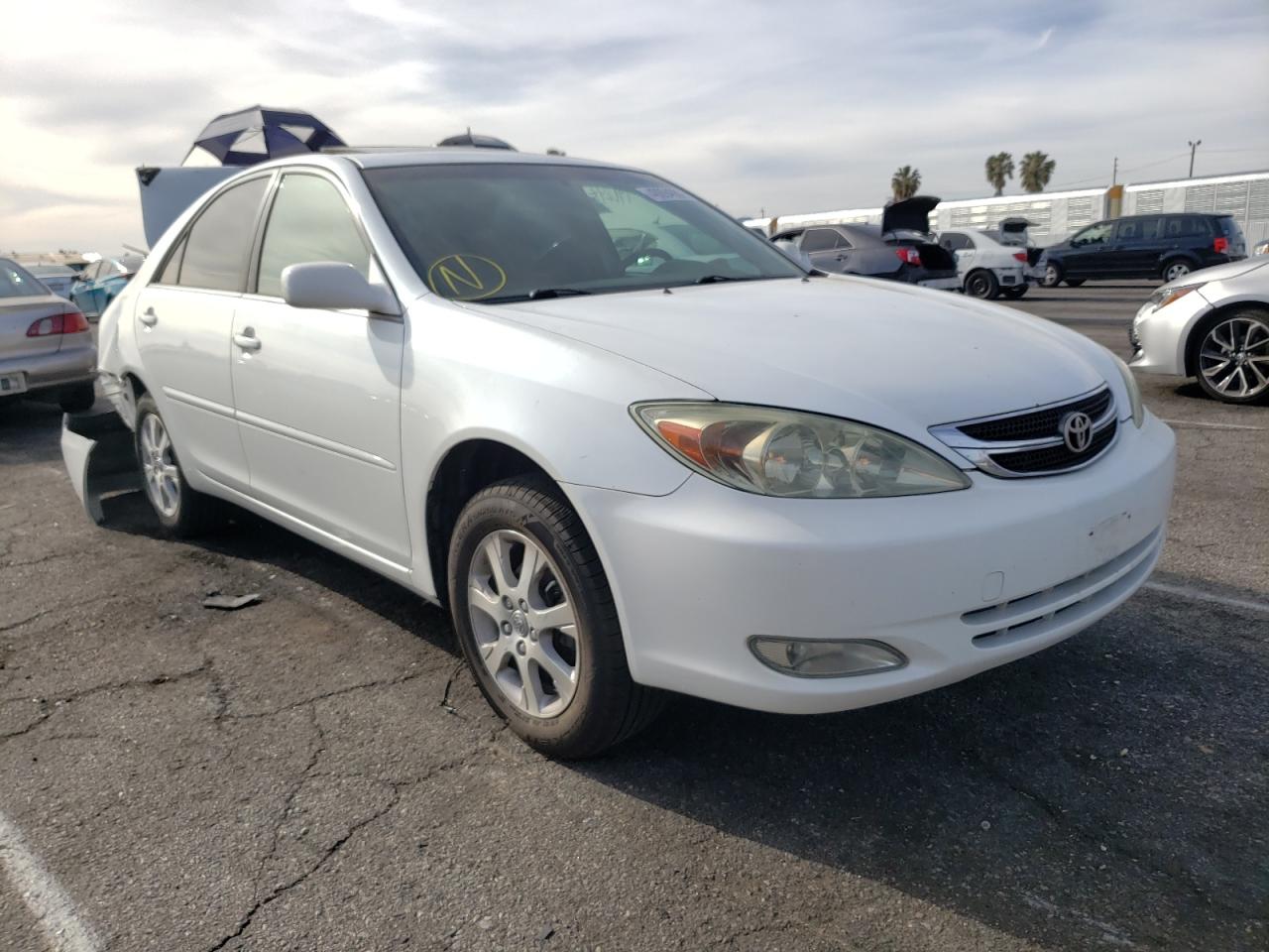 TOYOTA CAMRY LE 2004 with VIN JTDBE32KX40263306 - Photo from auction