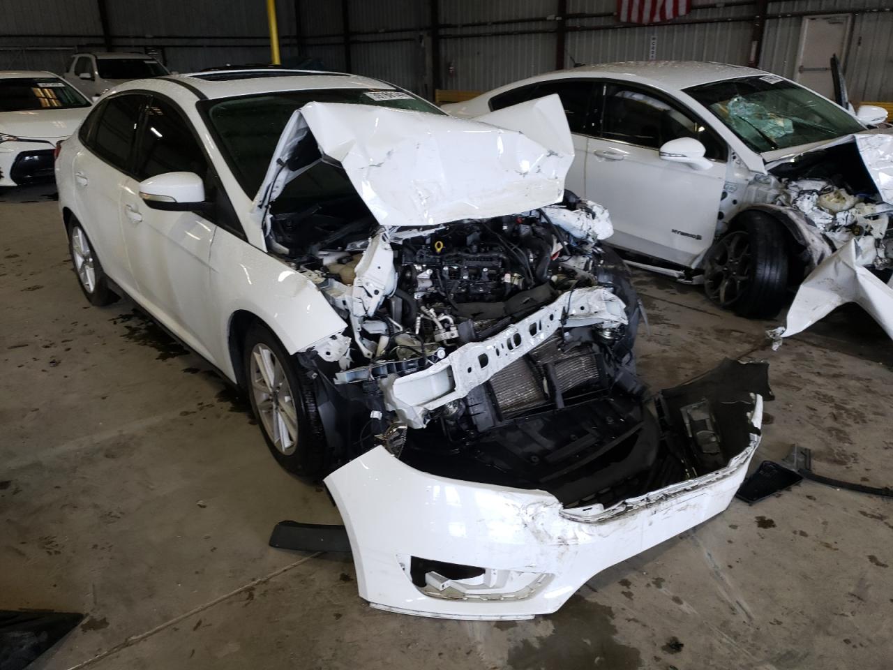 FORD FOCUS SE 2015 with VIN 1FADP3F29FL262670 - Photo from auction