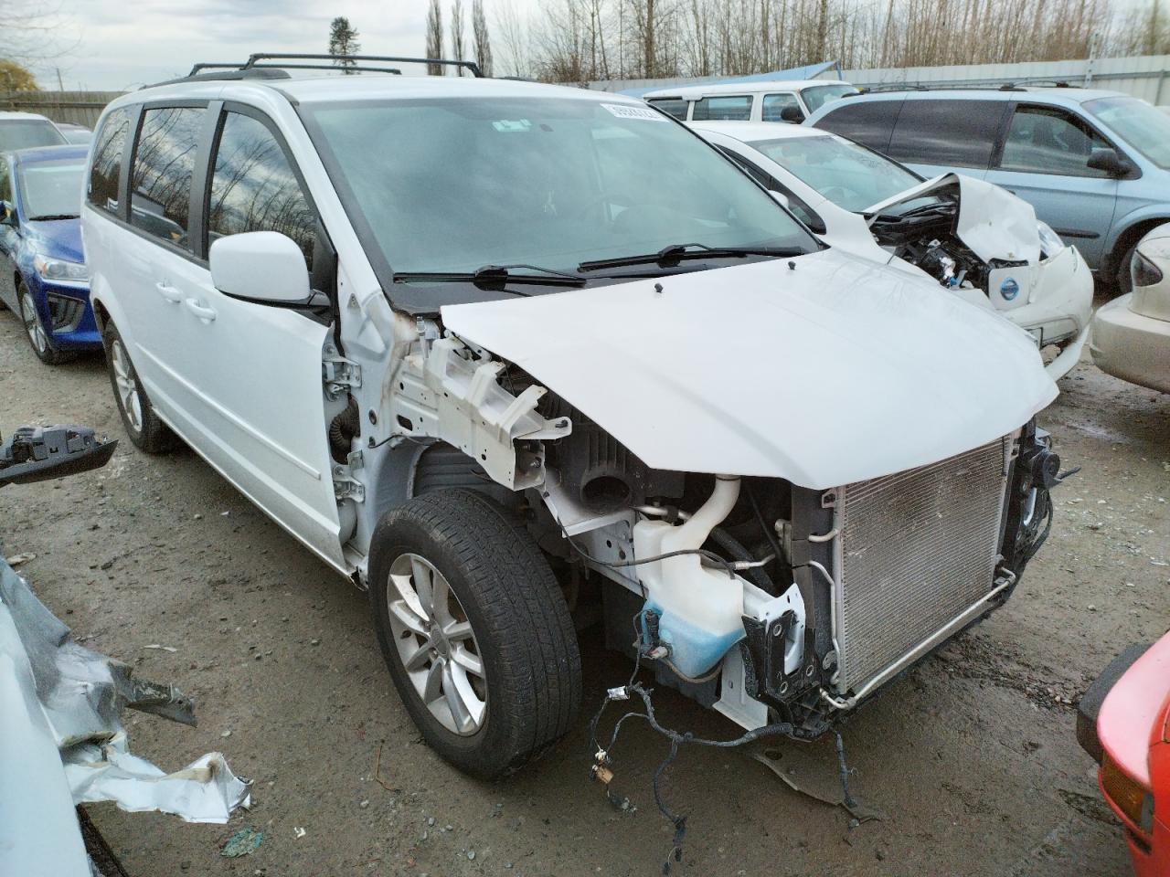 DODGE GRAND CARA 2014 with VIN 2C4RDGCG9ER244708 - Photo from auction