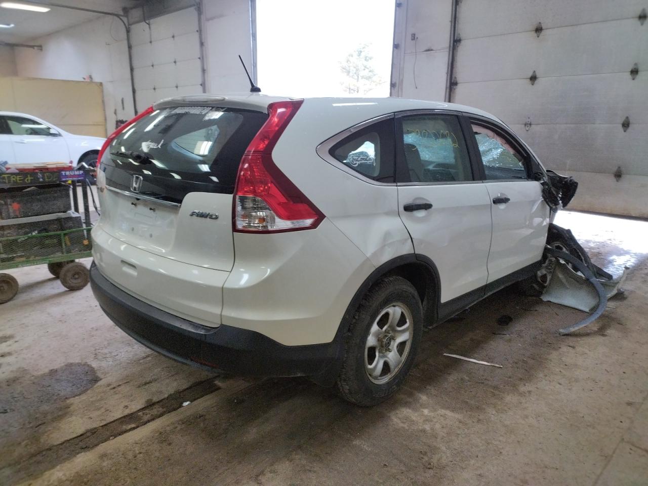 Photo 4 from auction – 2014 HONDA CR-V LX with VIN 5J6RM4H36EL092085