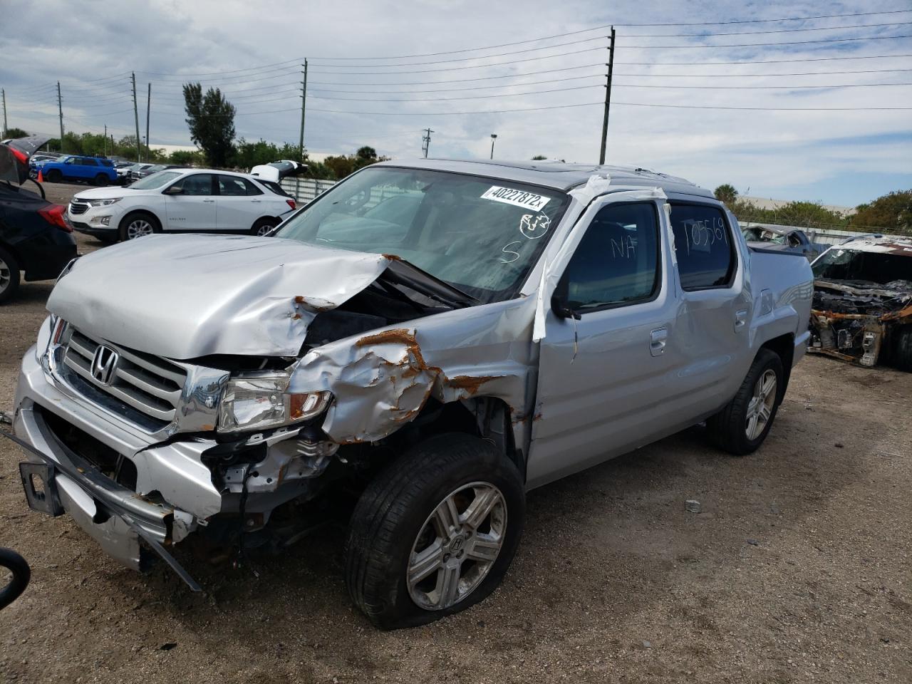 Photo 2 from auction – 2013 HONDA RIDGELINE with VIN 5FPYK1F50DB018311
