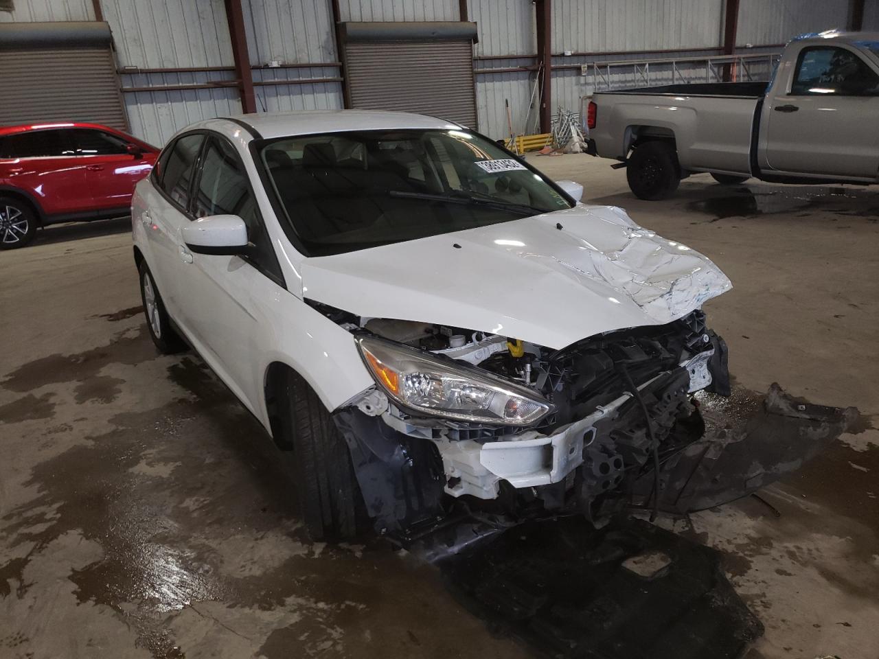 FORD FOCUS SE 2018 with VIN 1FADP3F22JL212993 - Photo from auction