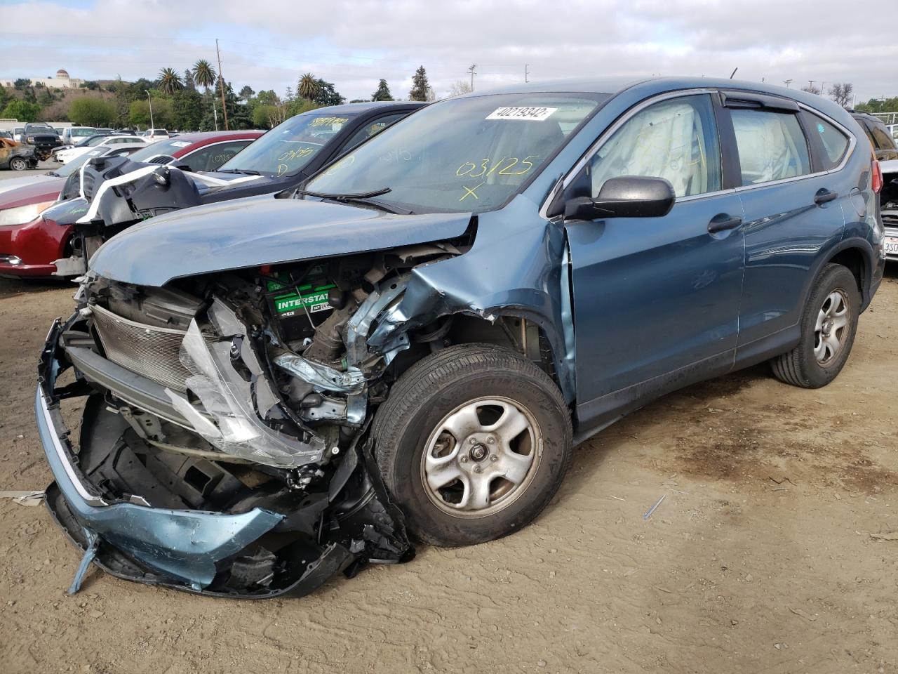 Photo 2 from auction – 2015 HONDA CR-V LX with VIN 5J6RM4H30FL072304