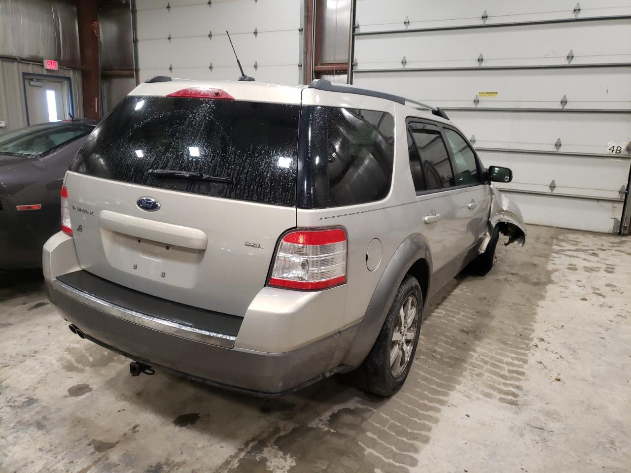Photo 4 from auction – 2009 FORD TAURUS X S with VIN 1FMDK02W79GA06312