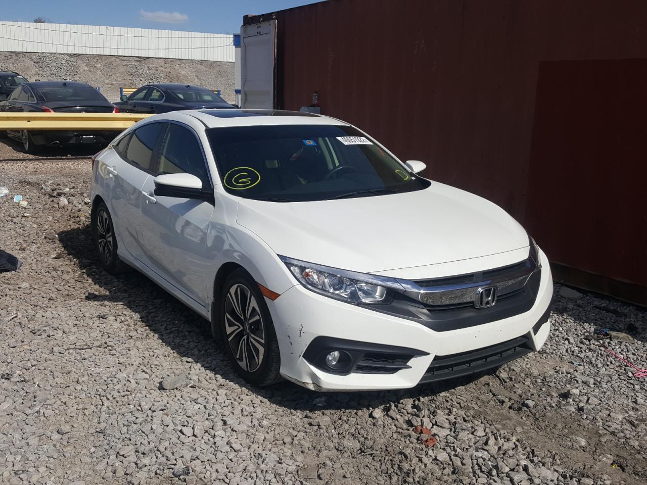 HONDA CIVIC EX 2018 with VIN JHMFC1F30JX001729 - Photo from auction
