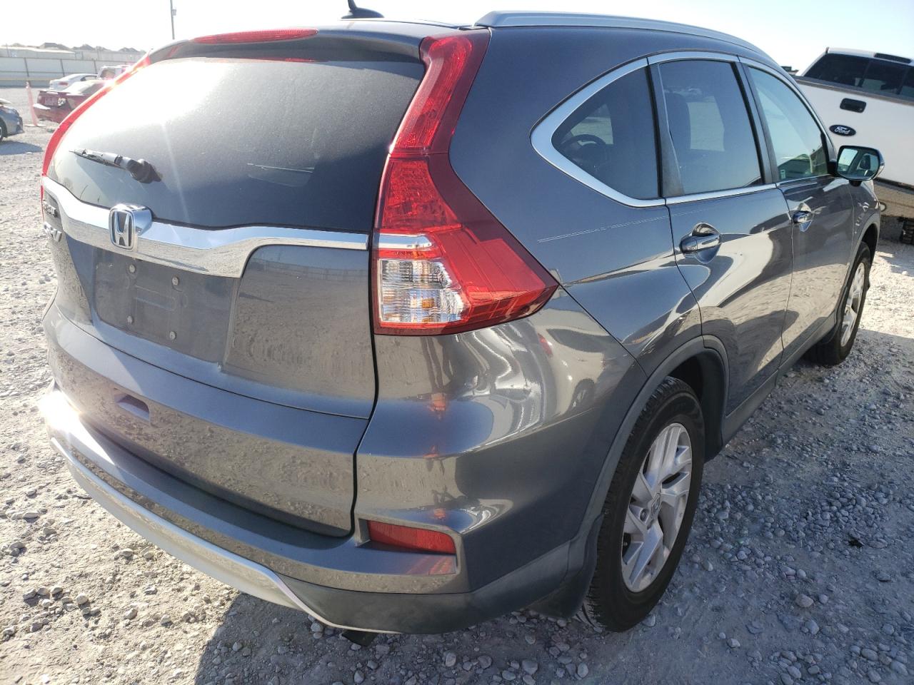 Photo 4 from auction – 2015 HONDA CR-V EXL with VIN 2HKRM3H77FH559068