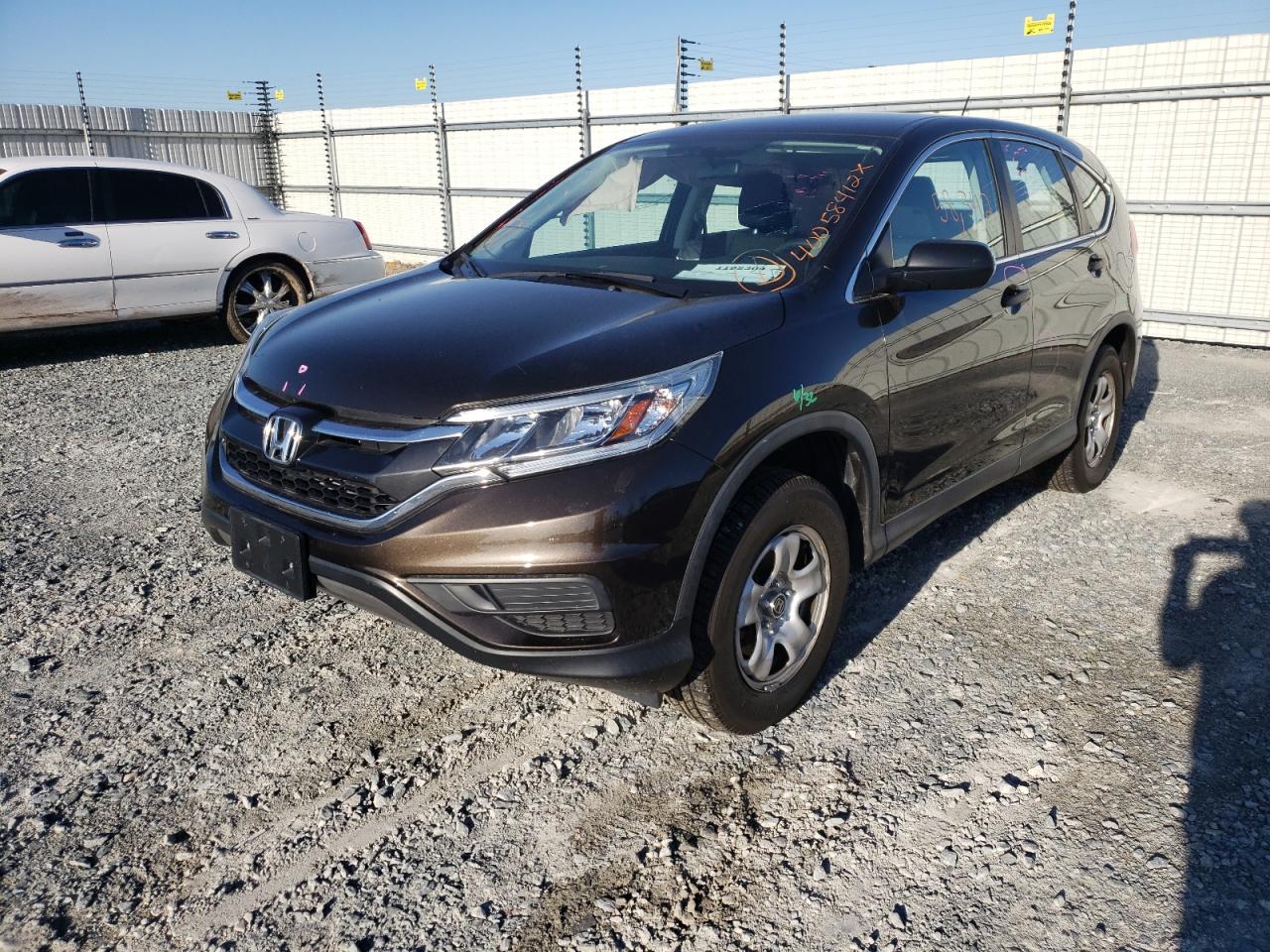 Photo 2 from auction – 2015 HONDA CR-V LX with VIN 5J6RM4H39FL013087