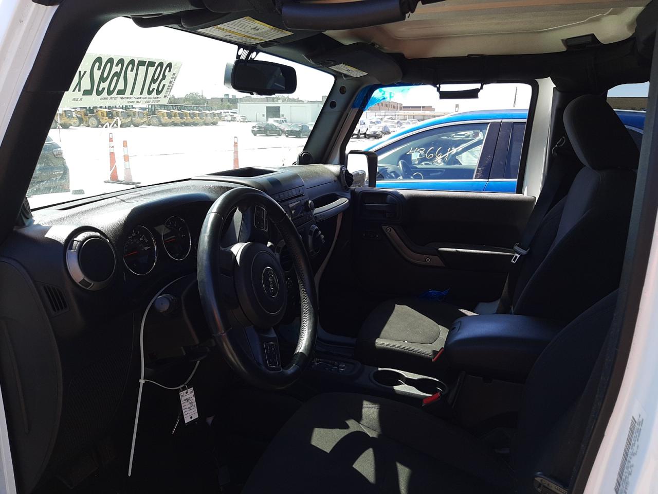 Photo 5 from auction – 2014 JEEP WRANGLER U with VIN 1C4BJWDG9EL251069