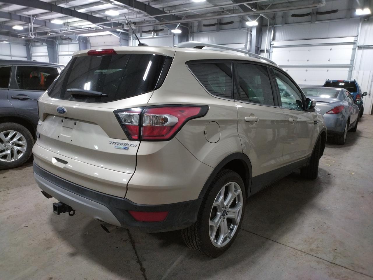 Photo 4 from auction – 2017 FORD ESCAPE TIT with VIN 1FMCU9J93HUB60814