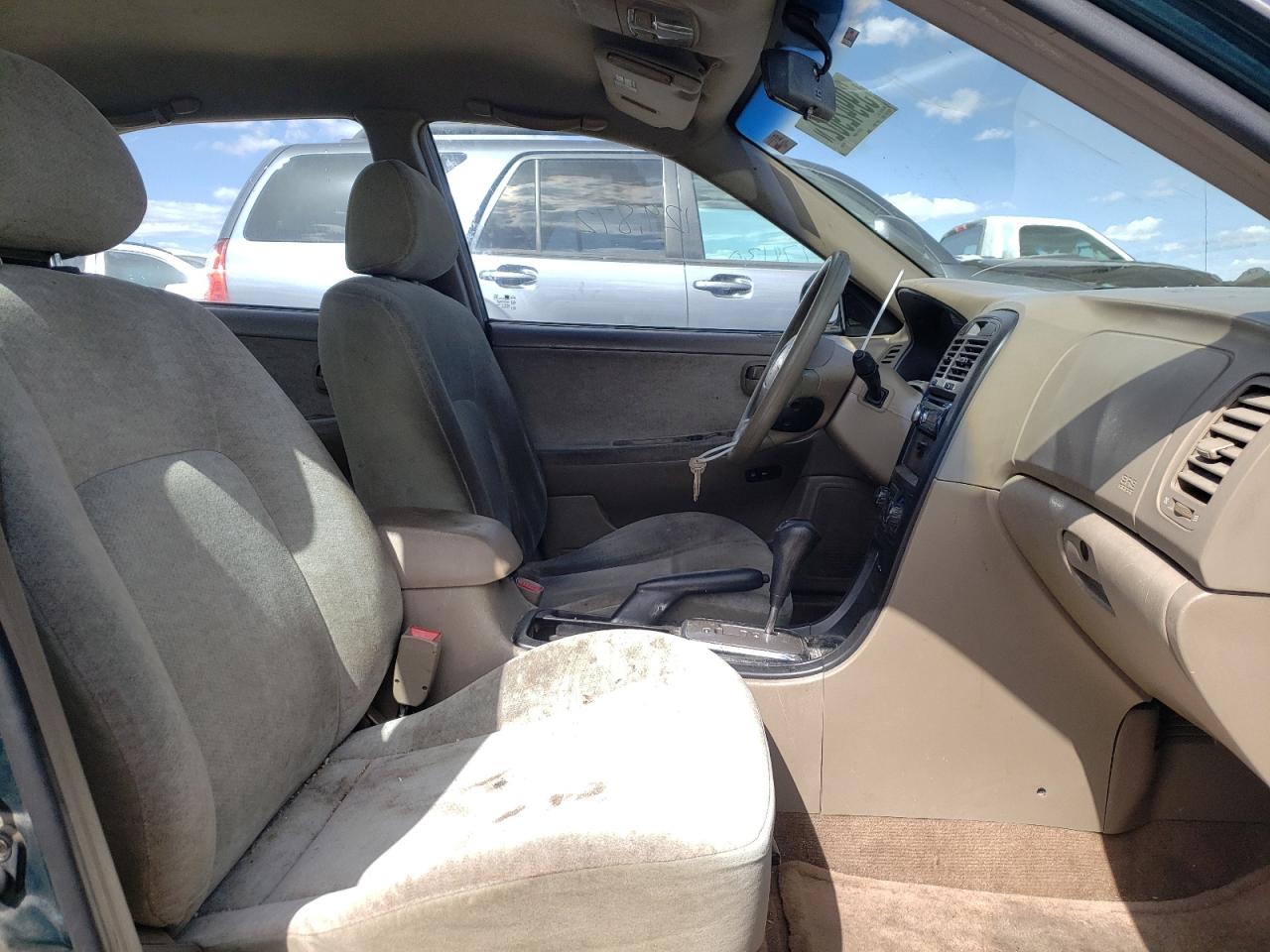 Photo 5 from auction – 2004 KIA OPTIMA LX with VIN KNAGD126145314529