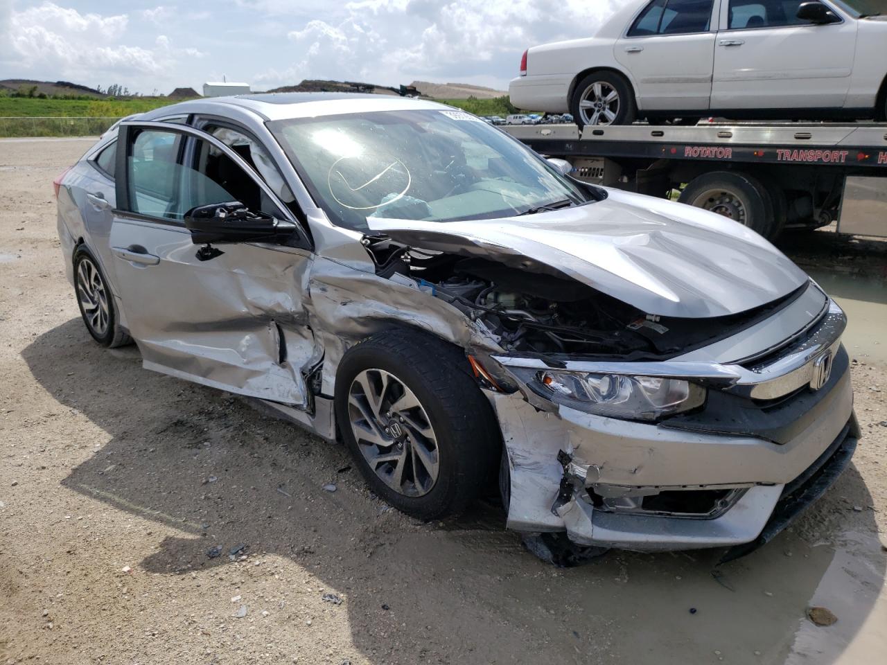 HONDA CIVIC EX 2018 with VIN 19XFC2F72JE016128 - Photo from auction