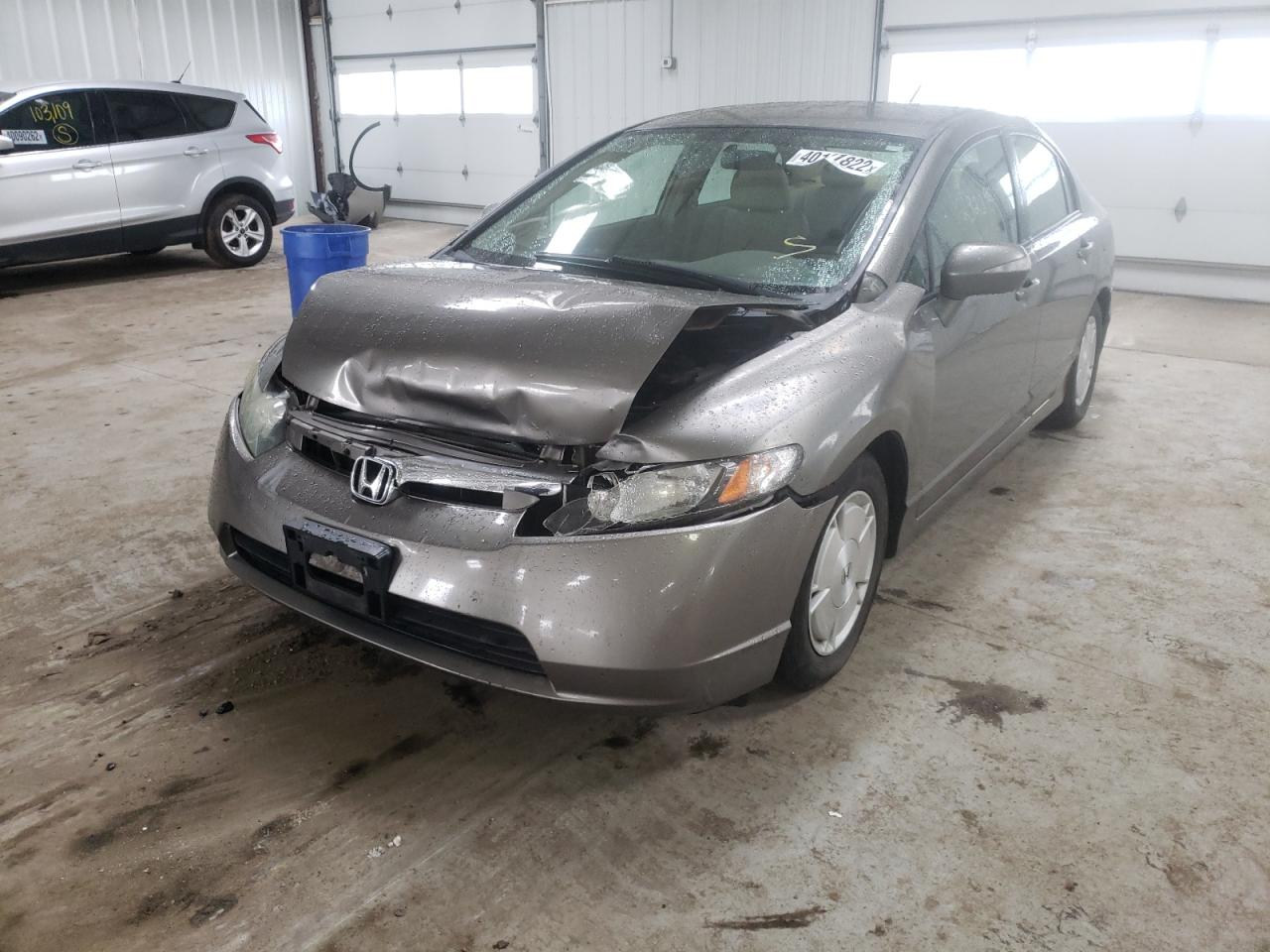 Photo 2 from auction – 2006 HONDA CIVIC HYBR with VIN JHMFA36216S014244