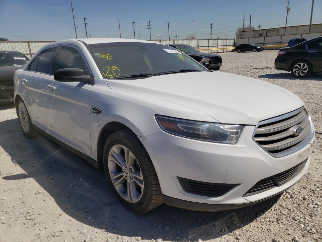 FORD TAURUS SE 2015 with VIN 1FAHP2D82FG208509 - Photo from auction