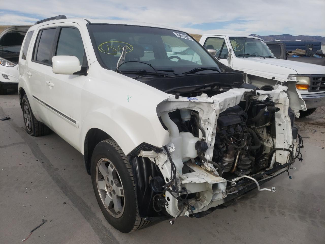 HONDA PILOT TOUR 2011 with VIN 5FNYF4H9XBB018067 - Photo from auction