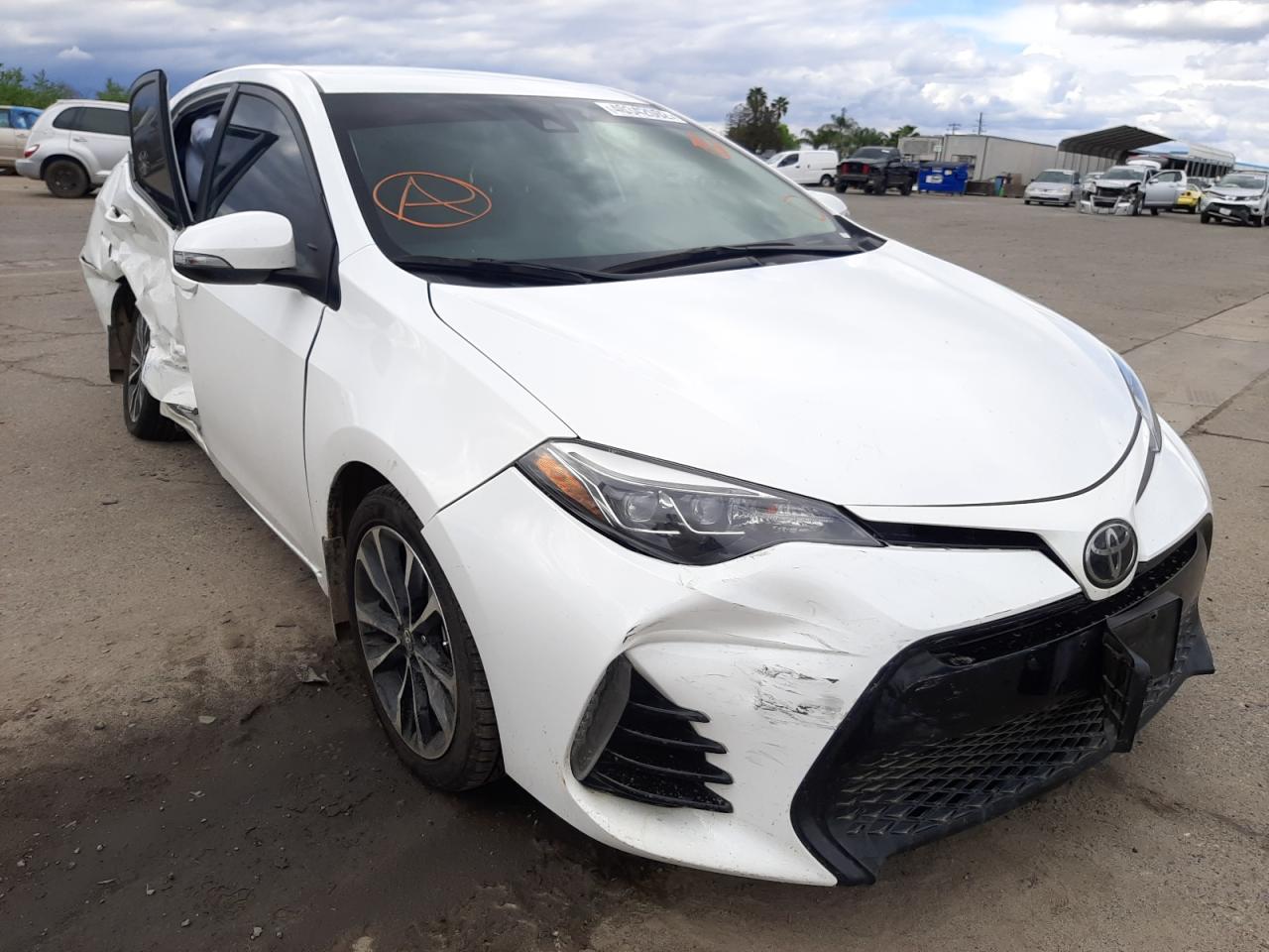 TOYOTA COROLLA L 2019 with VIN 5YFBURHE9KP873563 - Photo from auction