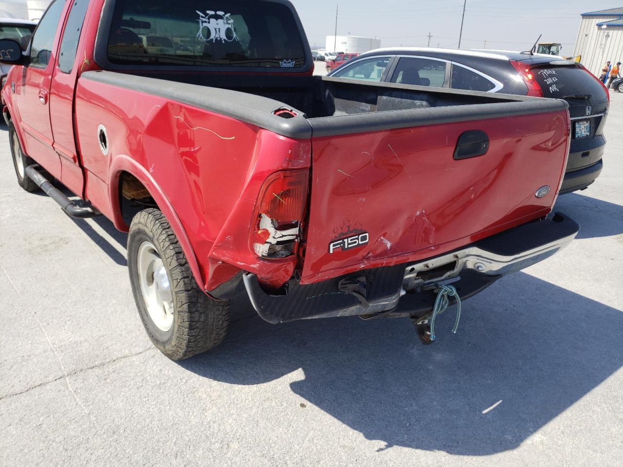 Photo 9 from auction – 2000 FORD F150 with VIN 1FTRX18W1YKB07463