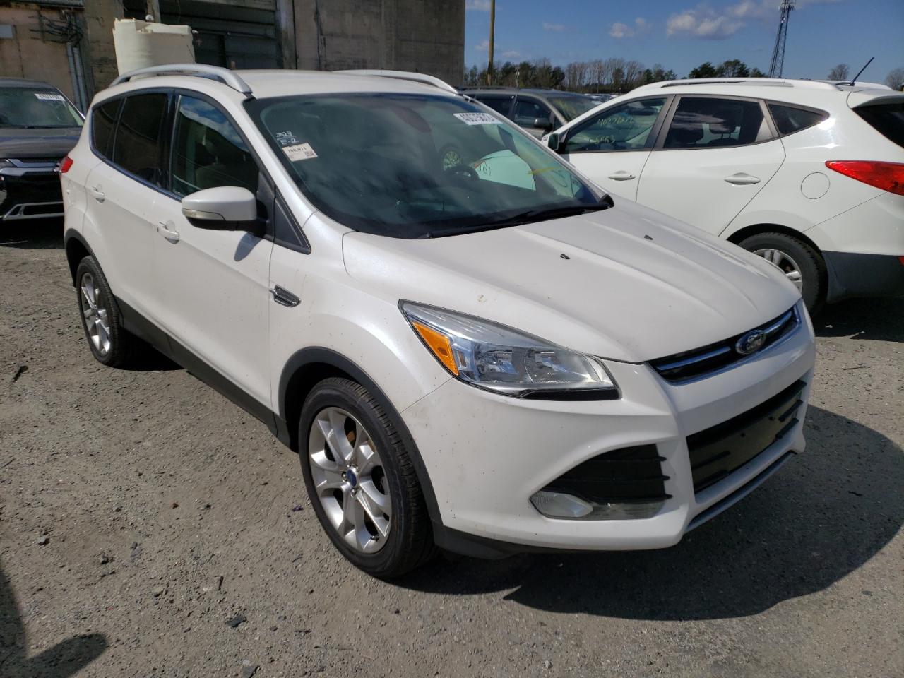 FORD ESCAPE TIT 2014 with VIN 1FMCU0JX0EUA43391 - Photo from auction