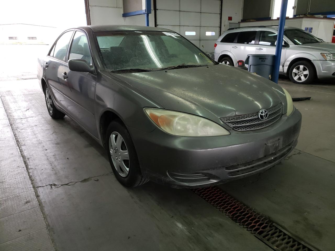 TOYOTA CAMRY LE 2002 with VIN JTDBE32K520073684 - Photo from auction