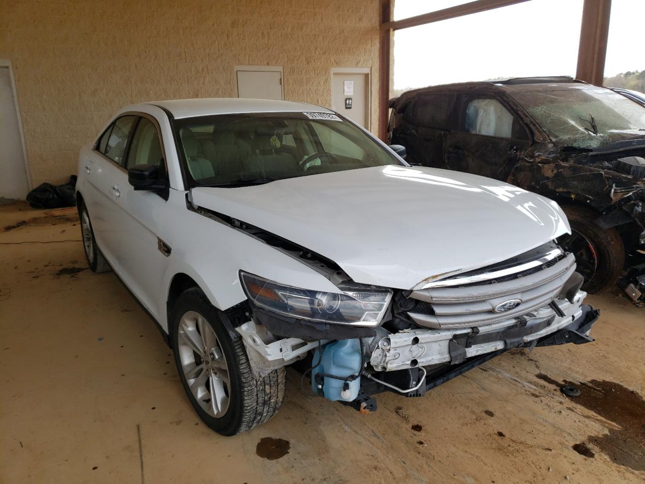FORD TAURUS SE 2015 with VIN 1FAHP2D84FG163511 - Photo from auction