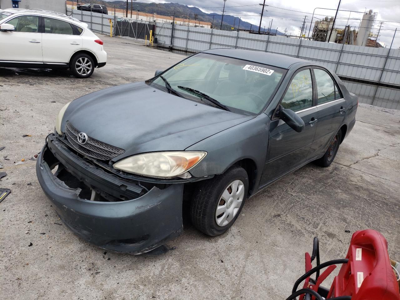 Photo 2 from auction – 2002 TOYOTA CAMRY LE with VIN JTDBE32K220068894