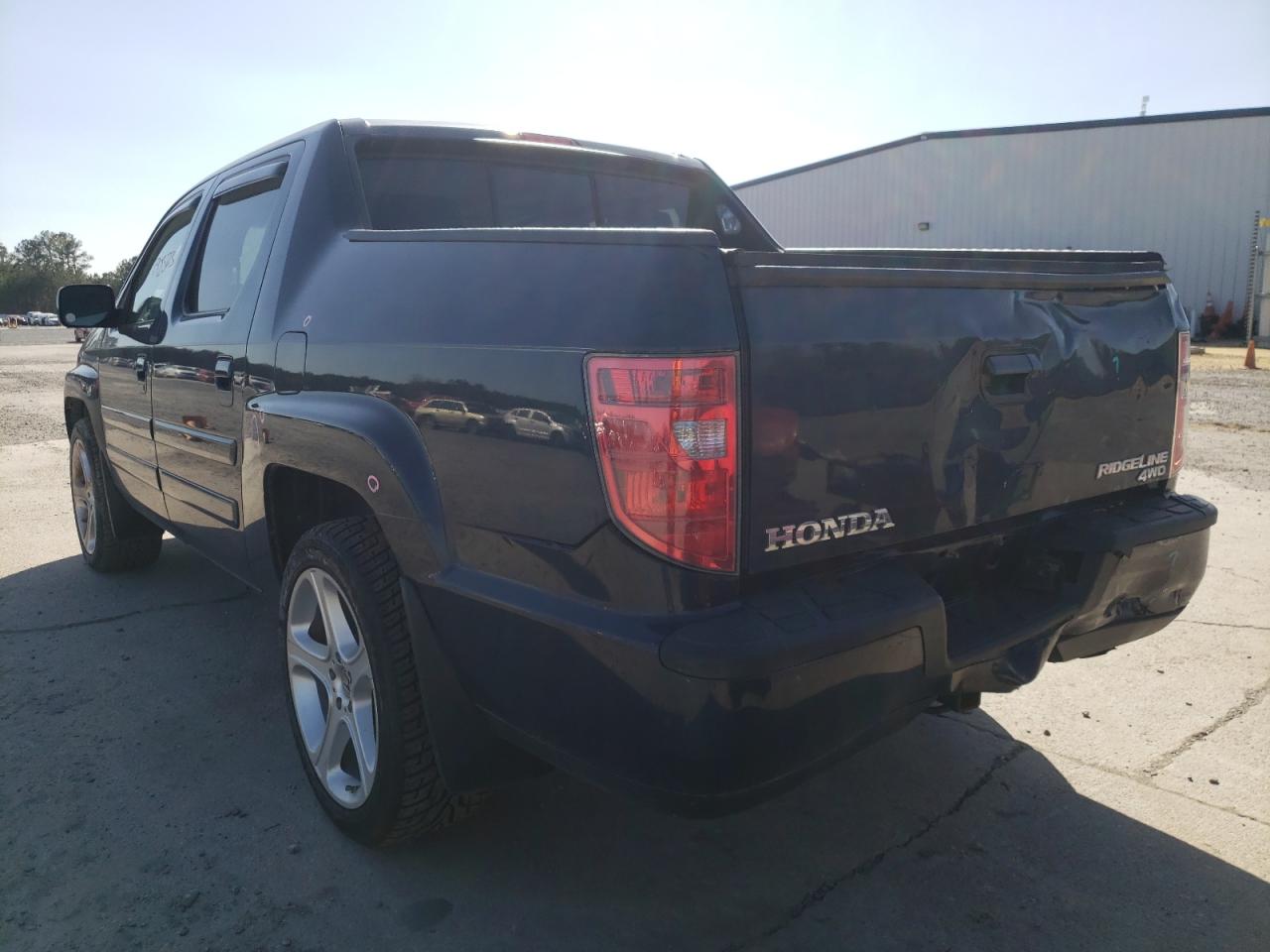 Photo 3 from auction – 2010 HONDA RIDGELINE with VIN 5FPYK1F57AB011366