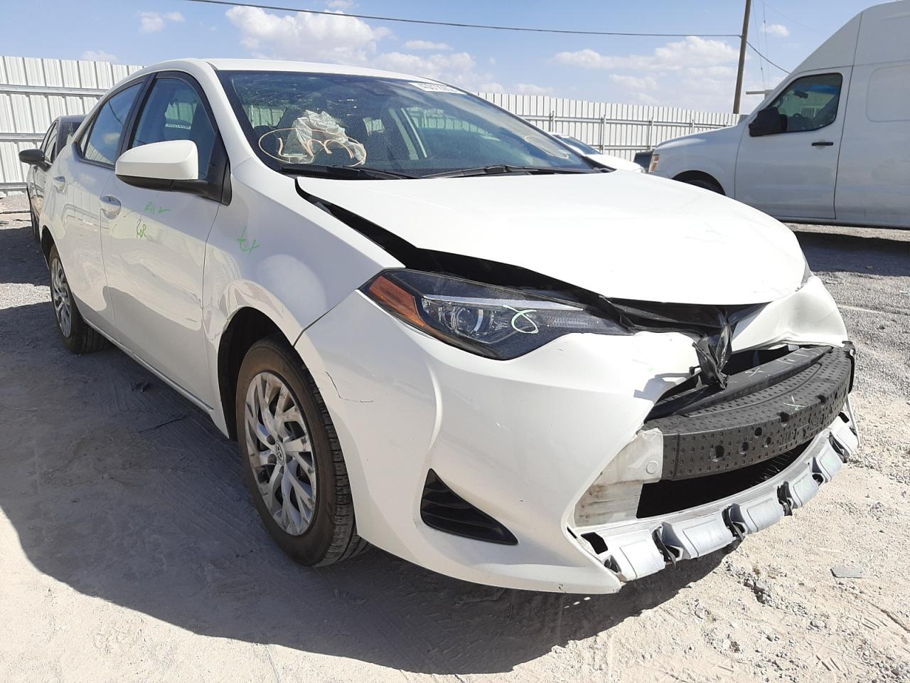 TOYOTA COROLLA LE 2018 with VIN 5YFBURHE3JP811221 - Photo from auction